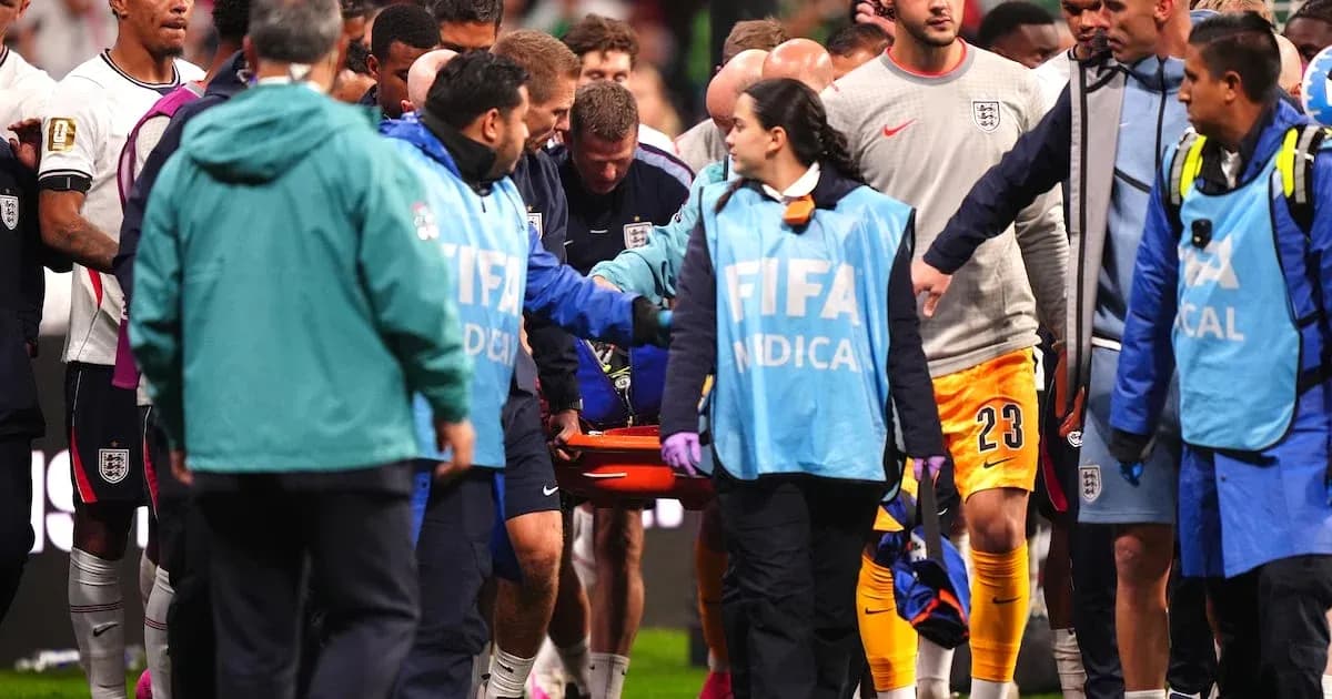 Medical team assisting injured player off the field