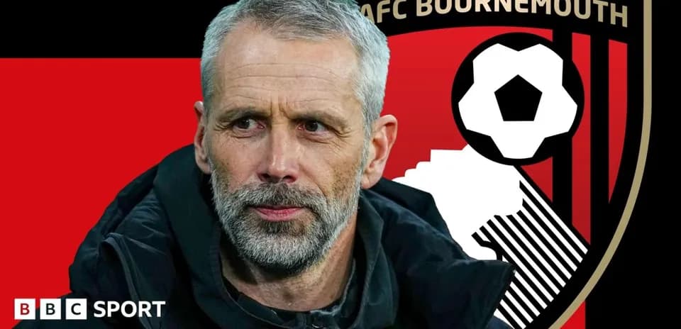 Coach in front of AFC Bournemouth club logo