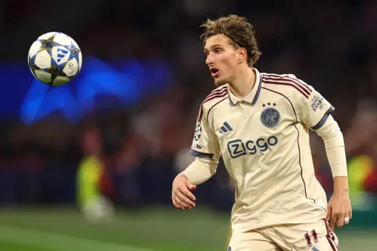 Player in Ajax kit tracking a floating ball