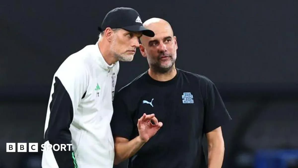 Two football managers discussing strategies on the field
