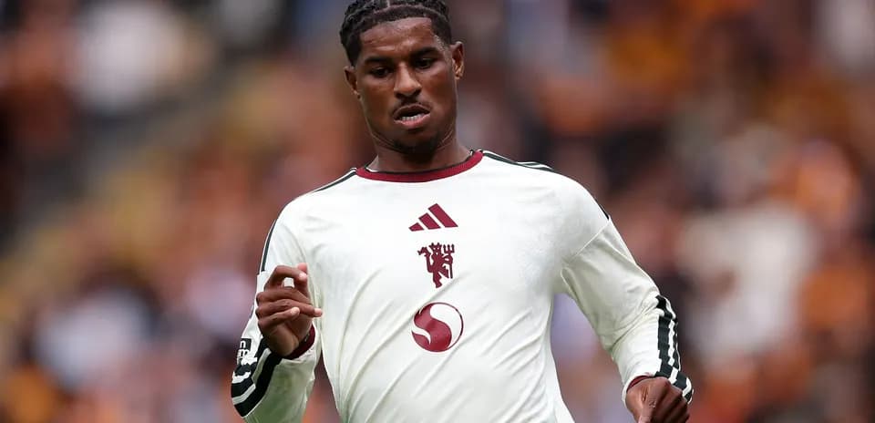 Player in white jersey running on the field