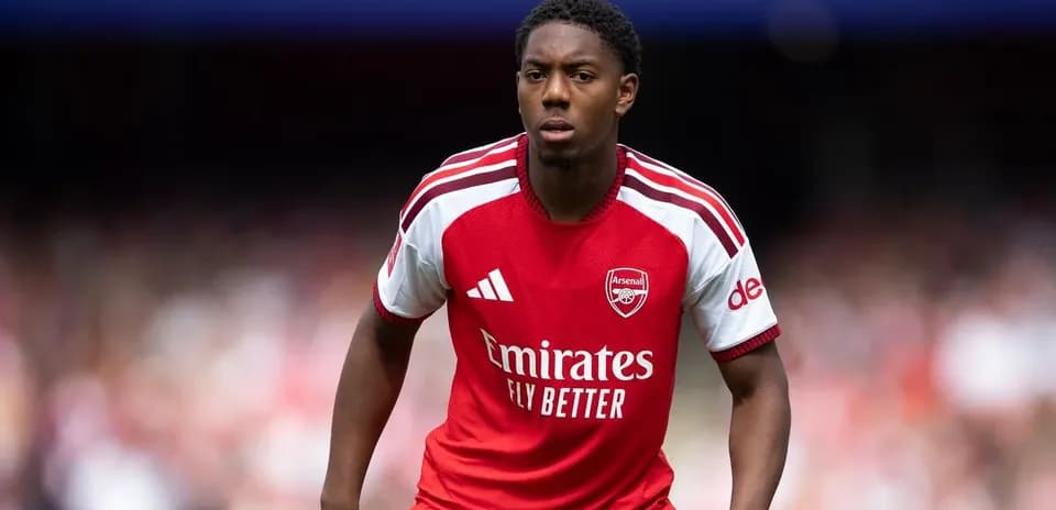 Player wearing Arsenal jersey during match action