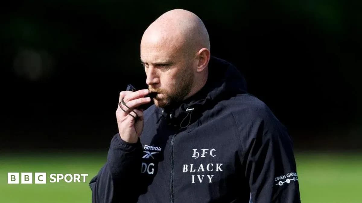 Coach using a whistle during training session
