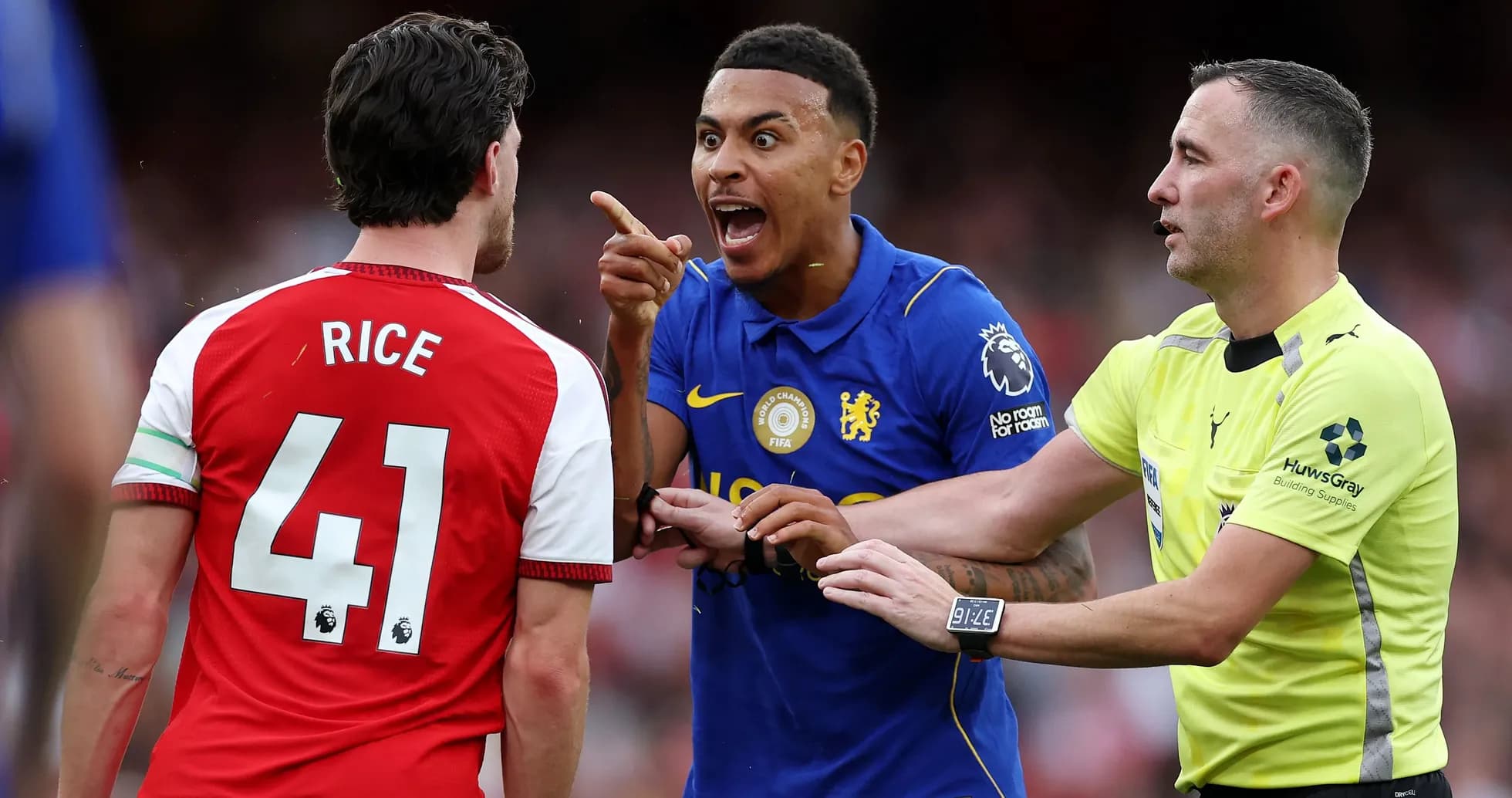 Players arguing with referee during football match
