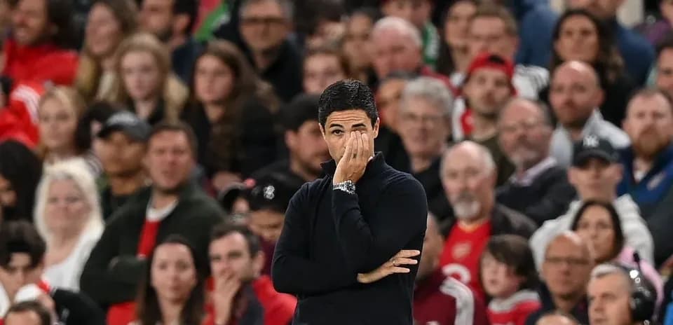 Manager observing match with focused expression