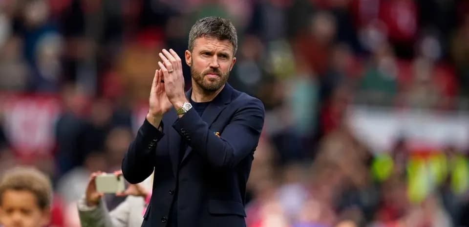 Coach applauding fans during post-match appreciation