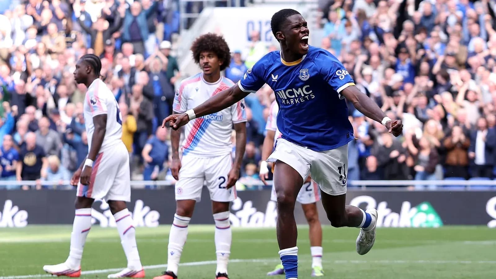 Player celebrating goal with crowd in background