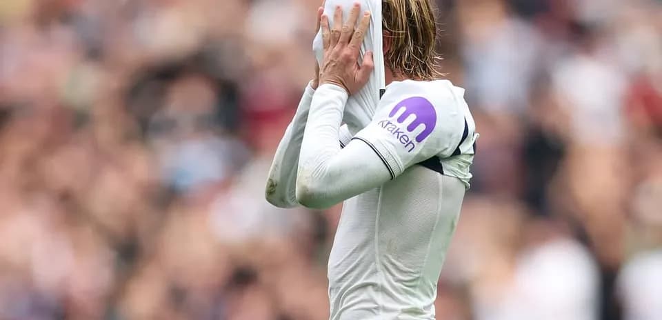 Player pulling shirt over head during match