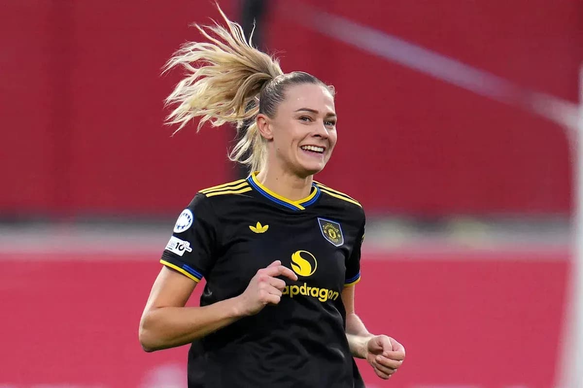 Player celebrating during a match in black uniform