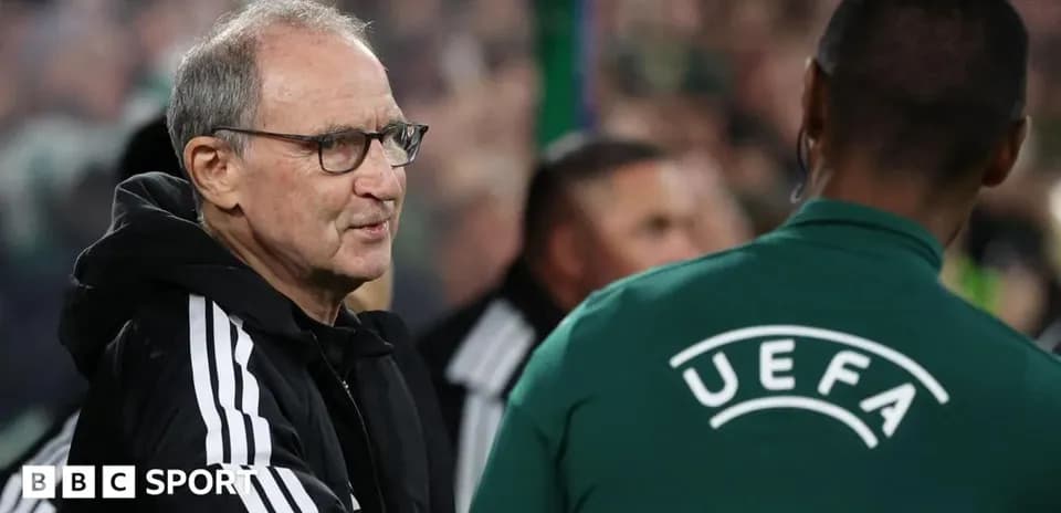 Manager speaking with UEFA official during match