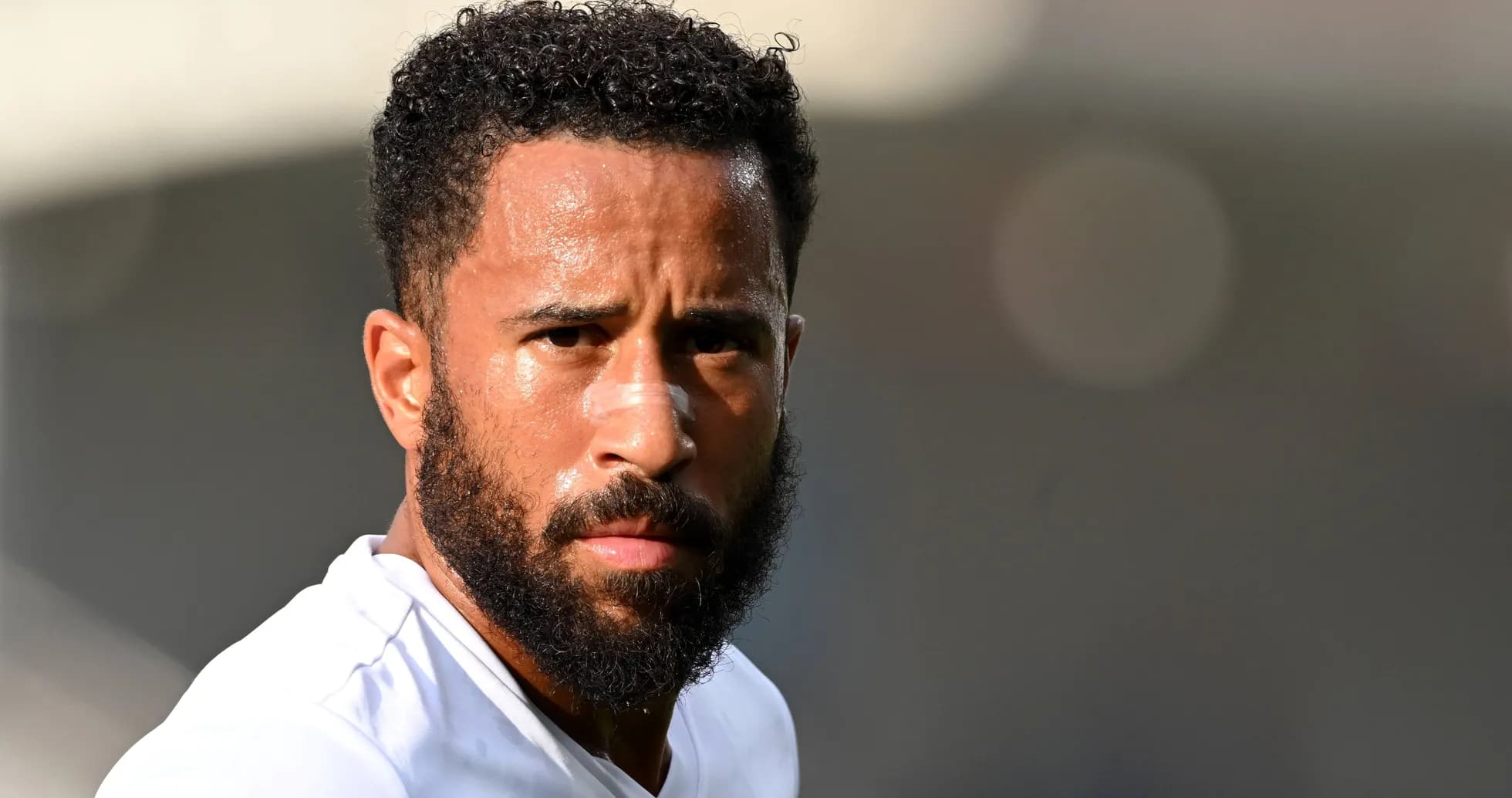 Player with beard and bandage during training session