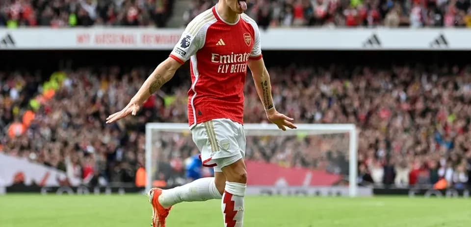 Arsenal player celebrating a goal at the stadium