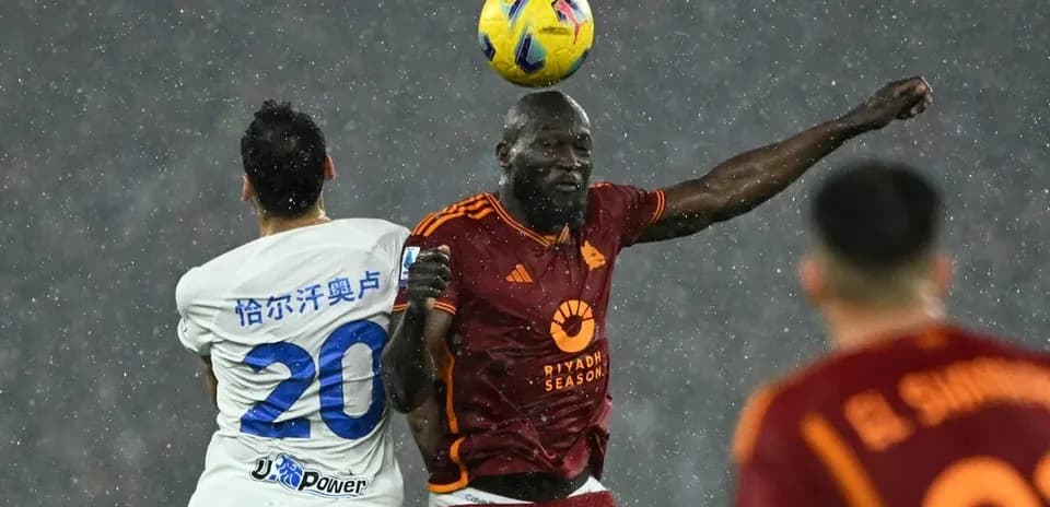 Player heading the ball during AS Roma match