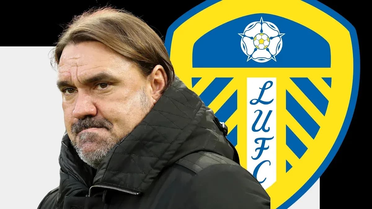 Coach in front of Leeds United logo background