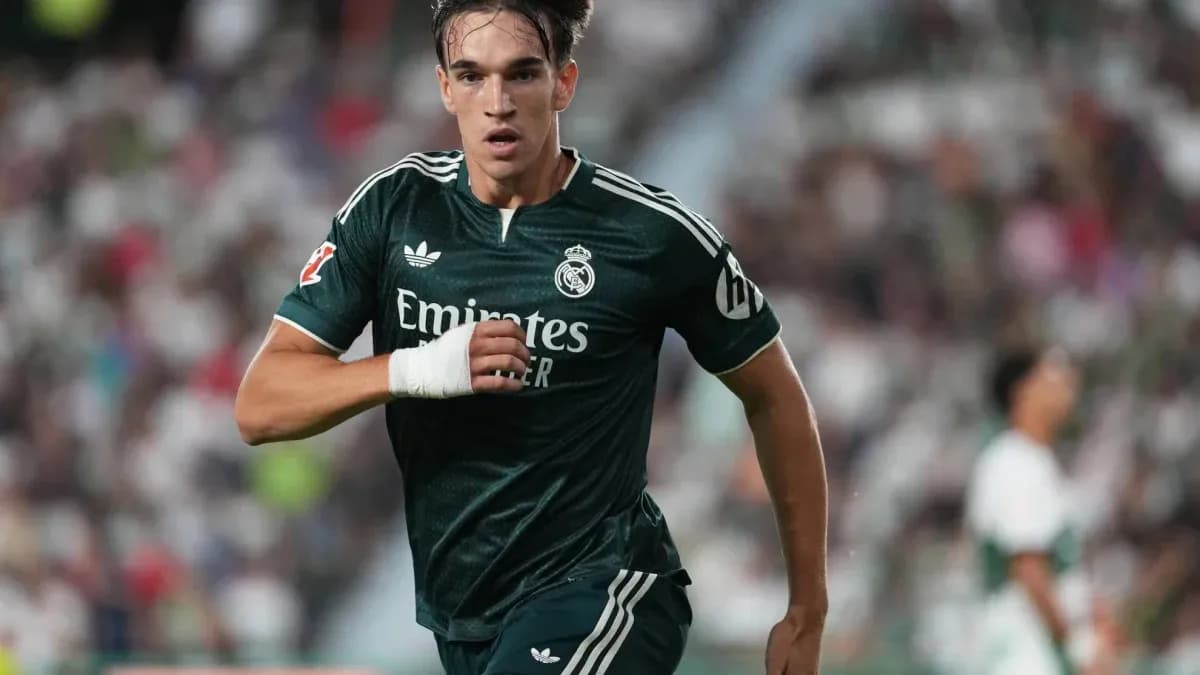 Player running during a match wearing Real Madrid kit