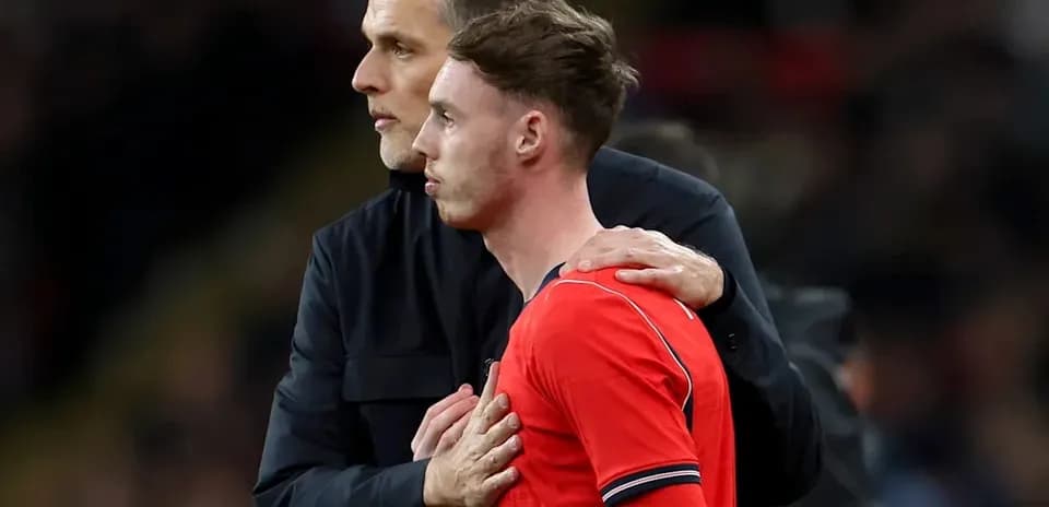 Coach discussing with player on the sidelines