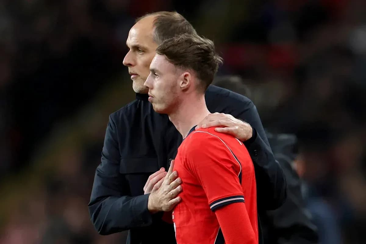 Coach discussing with player on the sidelines