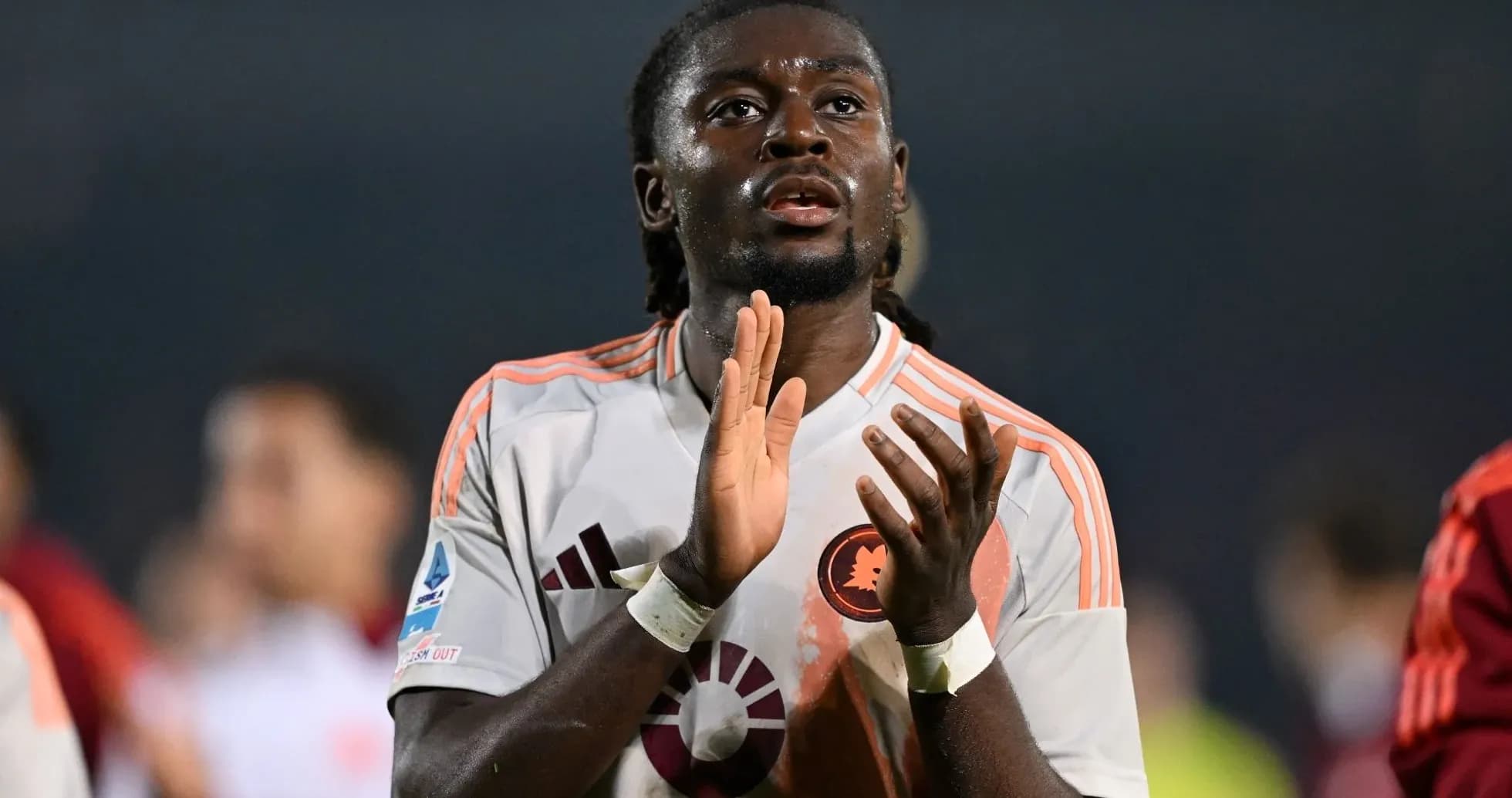 Player clapping after the match in team jersey