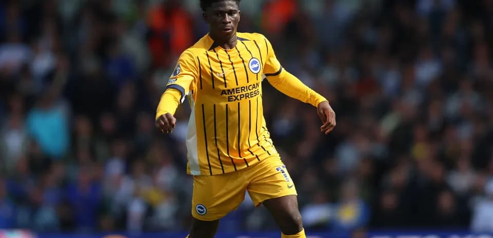 Player in yellow kit running during match