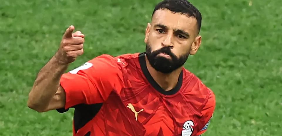 Player celebrating a goal in red team jersey