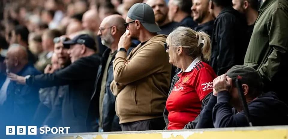 Fans watching the match in the stands