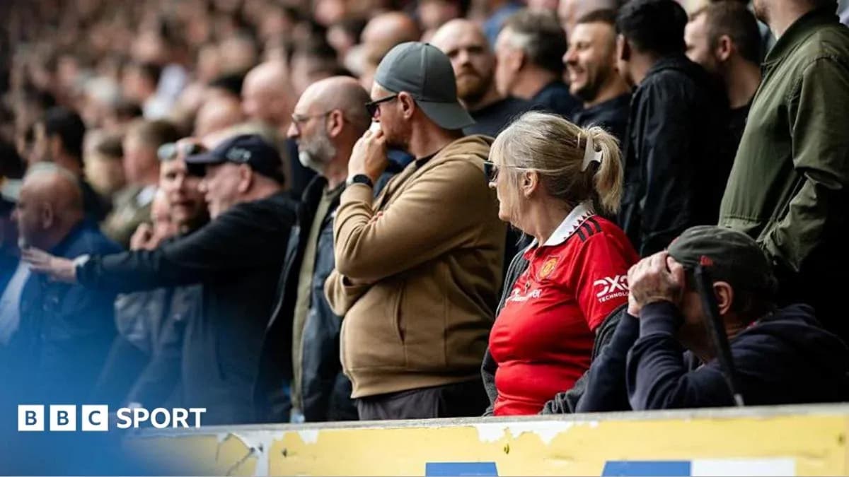 Fans watching the match in the stands
