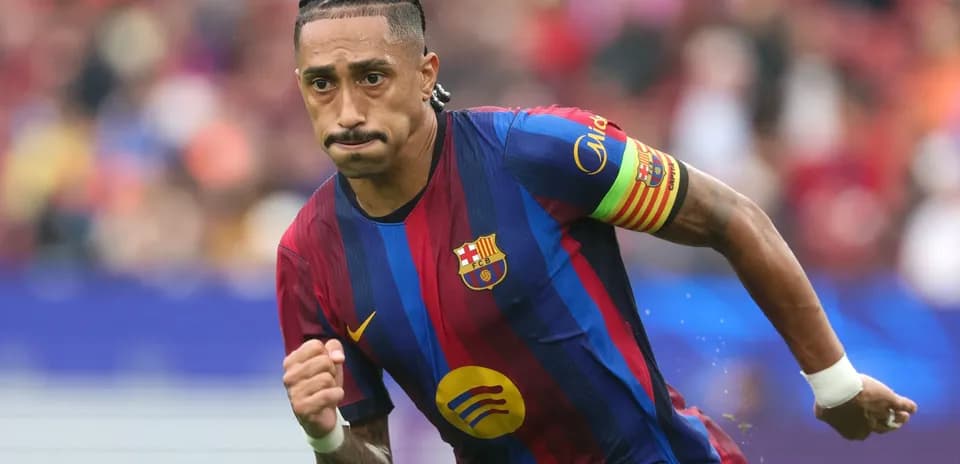 Player running on the pitch wearing Barcelona jersey