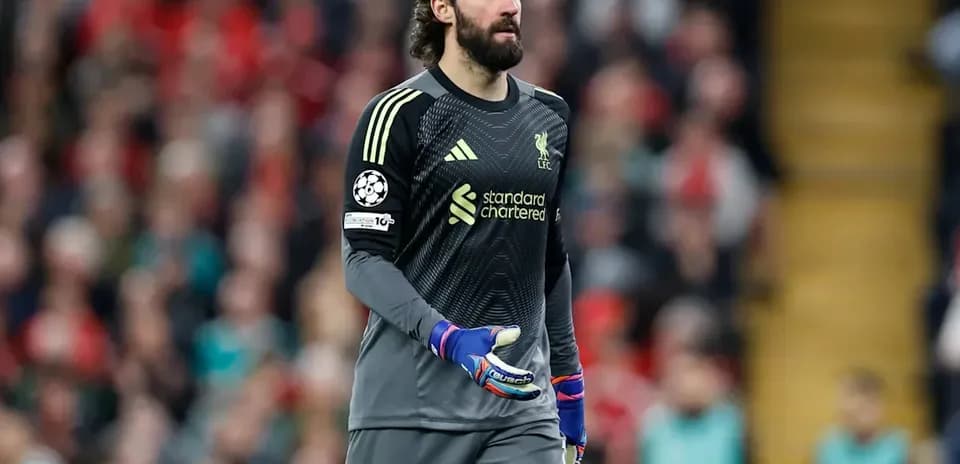 Goalkeeper Alisson Becker walking during a match