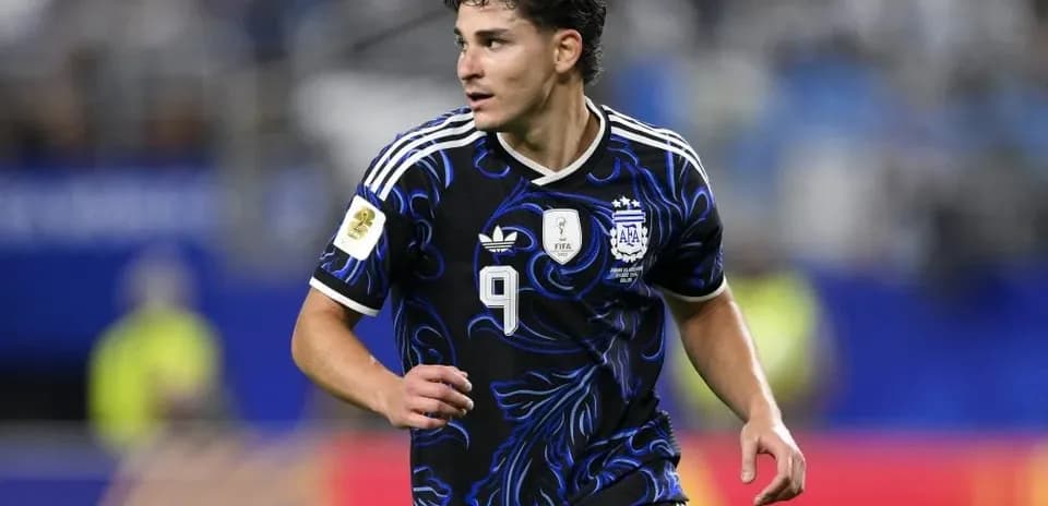 Player in Argentina kit running during match