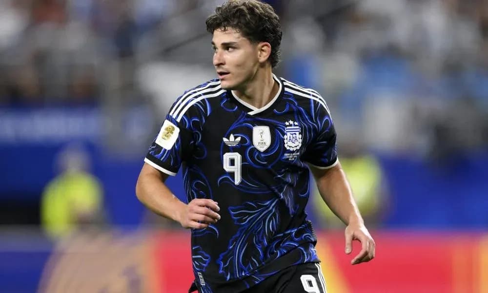 Player in Argentina kit running during match