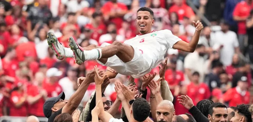 Player celebrated by teammates after victory