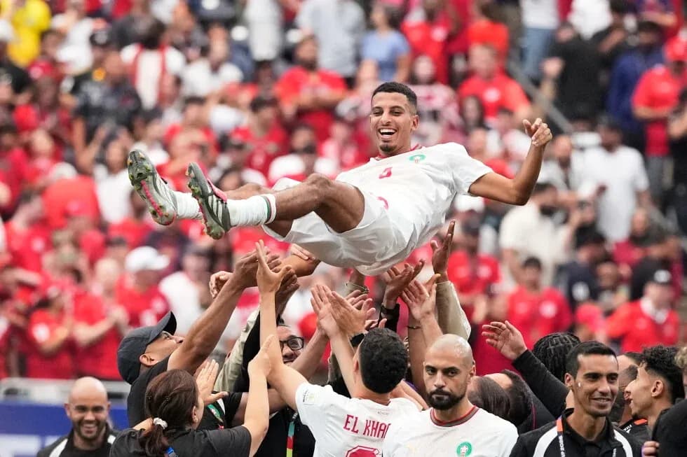 Player celebrated by teammates after victory