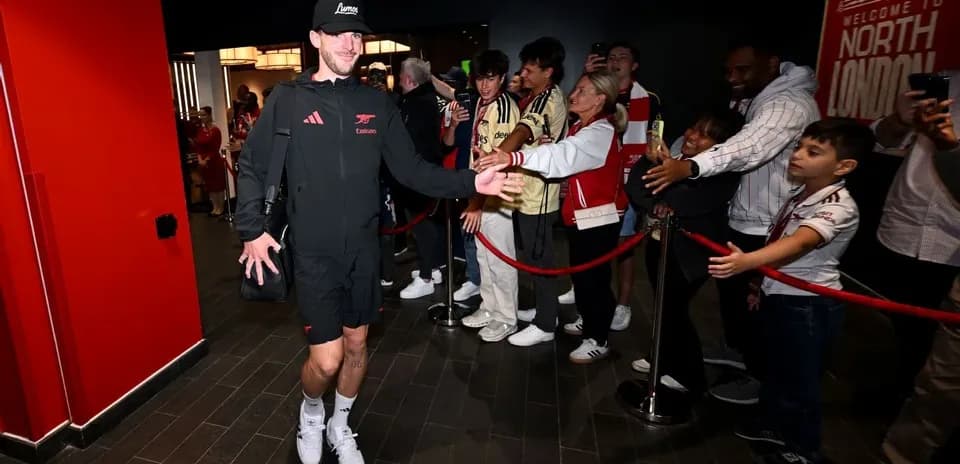 Player greeting fans in a venue entrance area