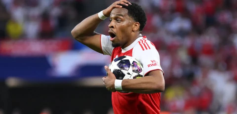 Player holding the ball with a surprised expression
