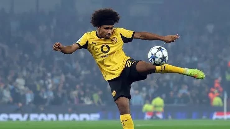 Player kicking ball during Champions League match