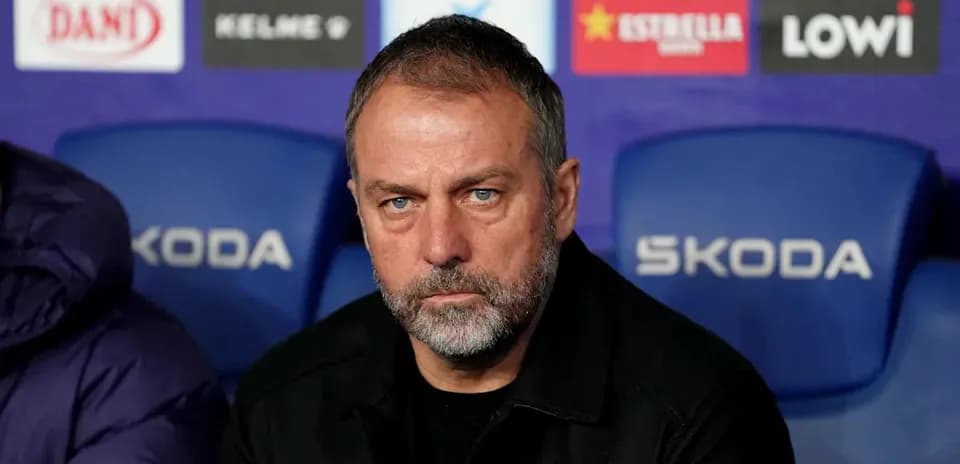 Coach sitting on bench during match preparations