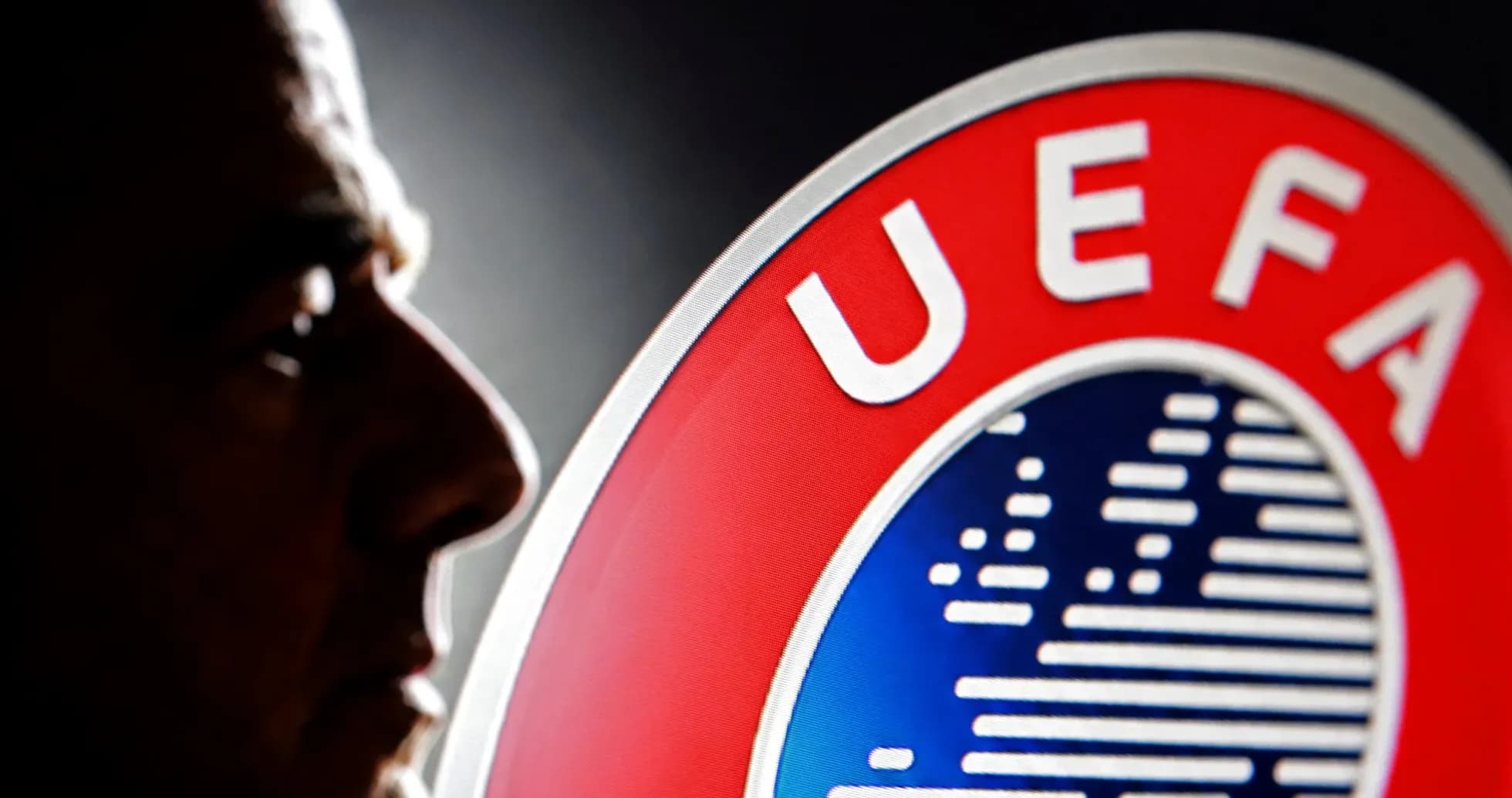 Profile of a man beside UEFA logo