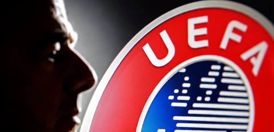Profile of a man beside UEFA logo