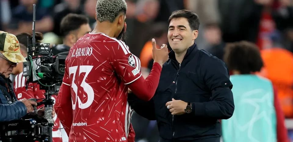 Player and coach interacting on the sidelines