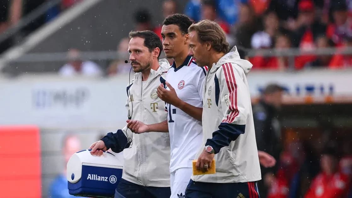 Player receiving medical attention from staff on field