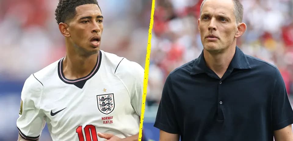 Football player in England kit and coach on field