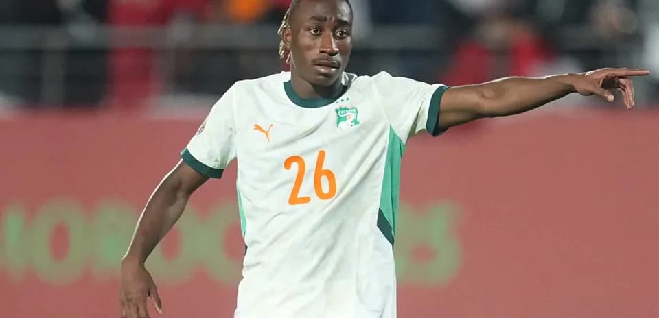 Player 26 from Ivory Coast directing teammates on field