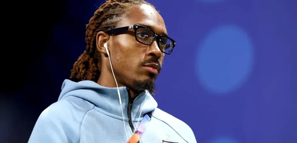 Player wearing glasses and earphones before match