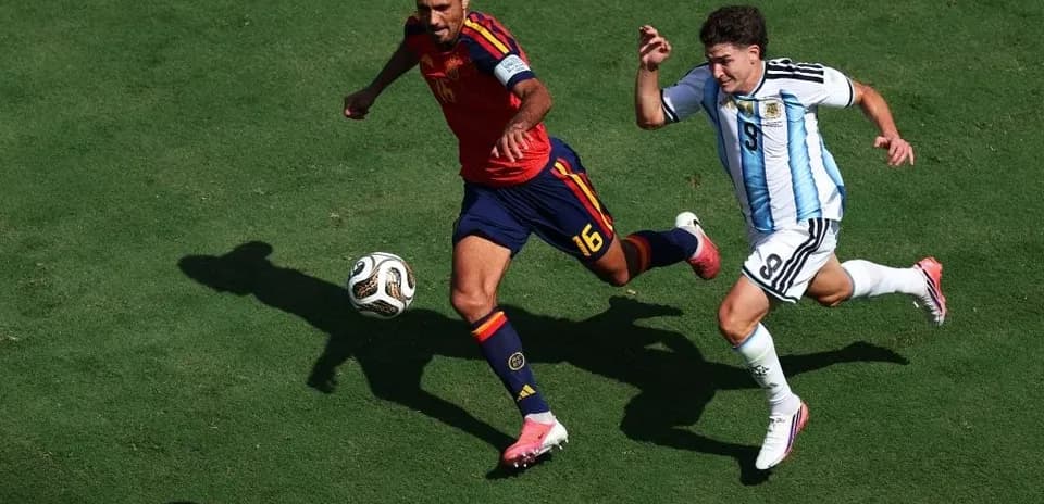 Two players racing for the ball during match
