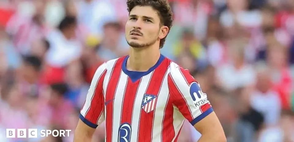 Player in red and white jersey during match