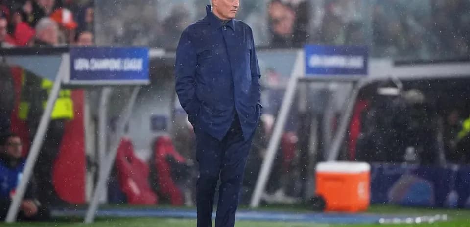 Coach standing on the sideline during a match