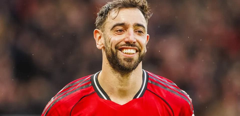 Player in red jersey smiling during match