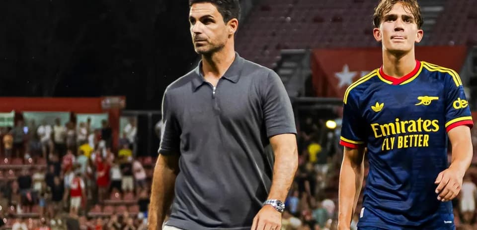Manager and player walking off the pitch