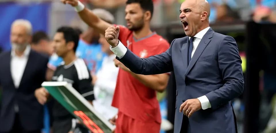 Coach passionately directing players during match
