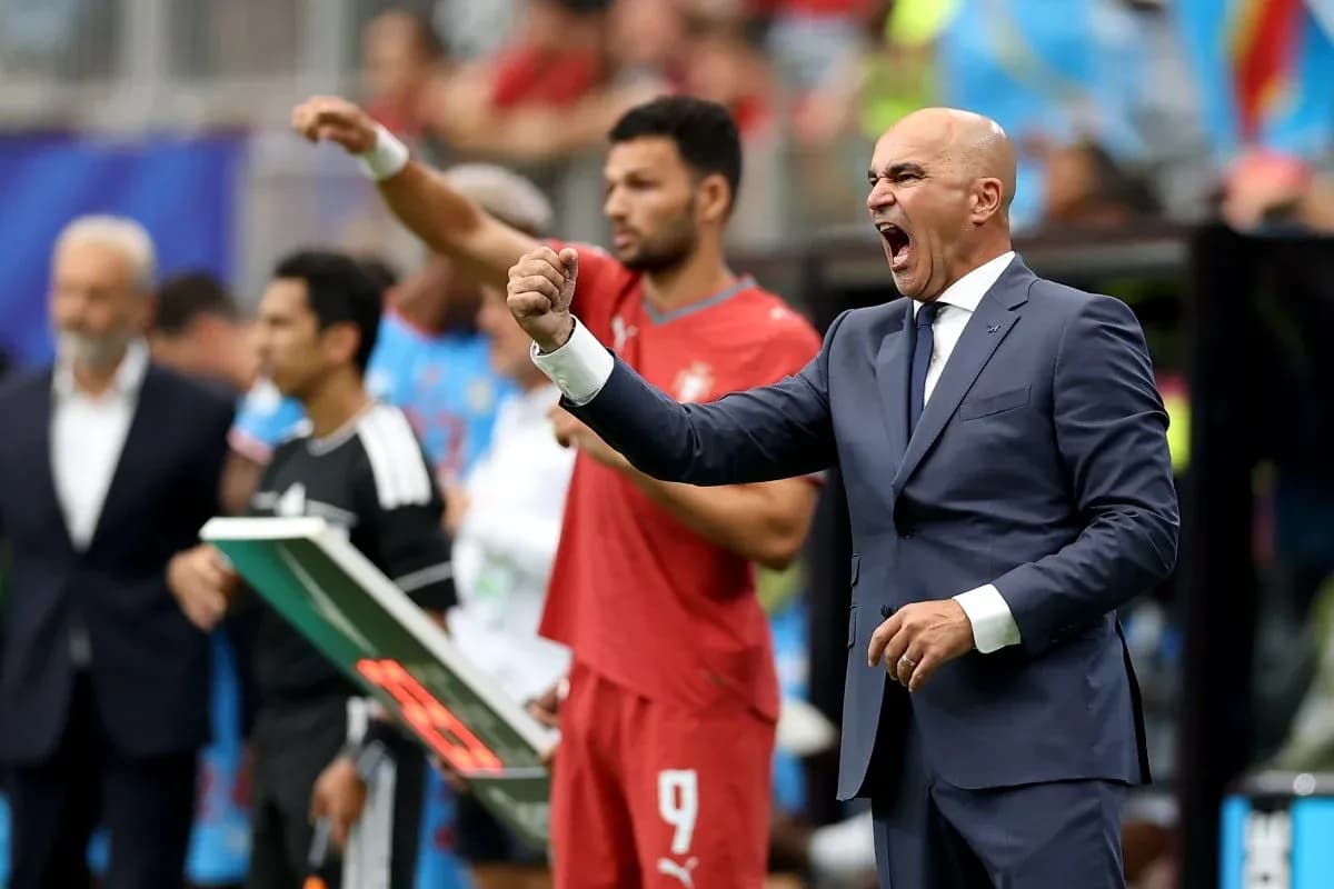 Coach passionately directing players during match